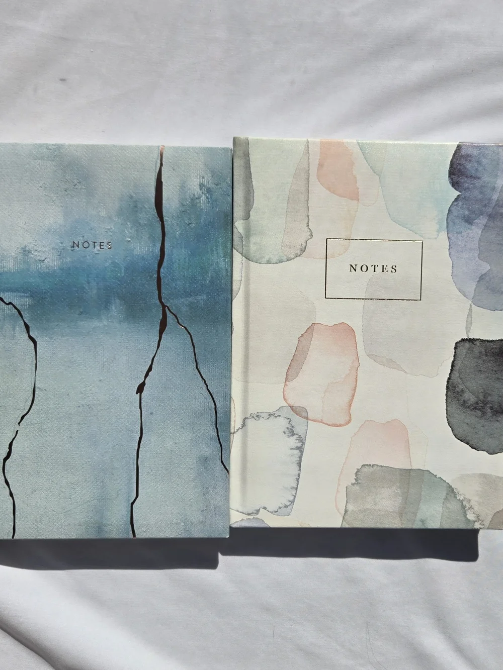 Two Indigo Paper lined notebooks, 10x7 In, padded hardcover, pastel watercolor